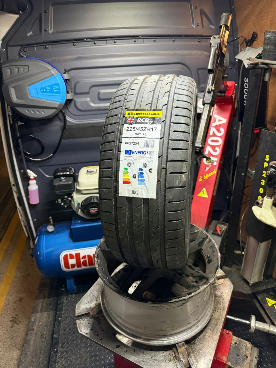 Fresh tyre fitted to an alloy wheel on the balancer, ready to go back on the vehicle