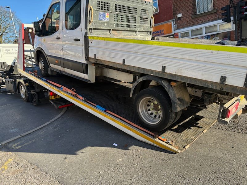 Recovery truck loading a van for breakdown towing near Tyldesley.